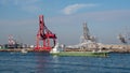 ÃÂ¡argo ship in Osaka Japan in front of floating cranes. Freighter ship in Osaka Japan